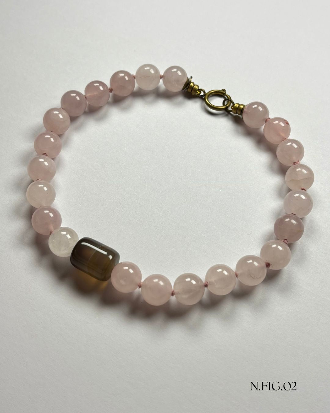 16-inch necklace featuring soft pink rose quartz and grey lace agate beads, elegantly strung on silk. The gentle hues evoke calm and emotional warmth.