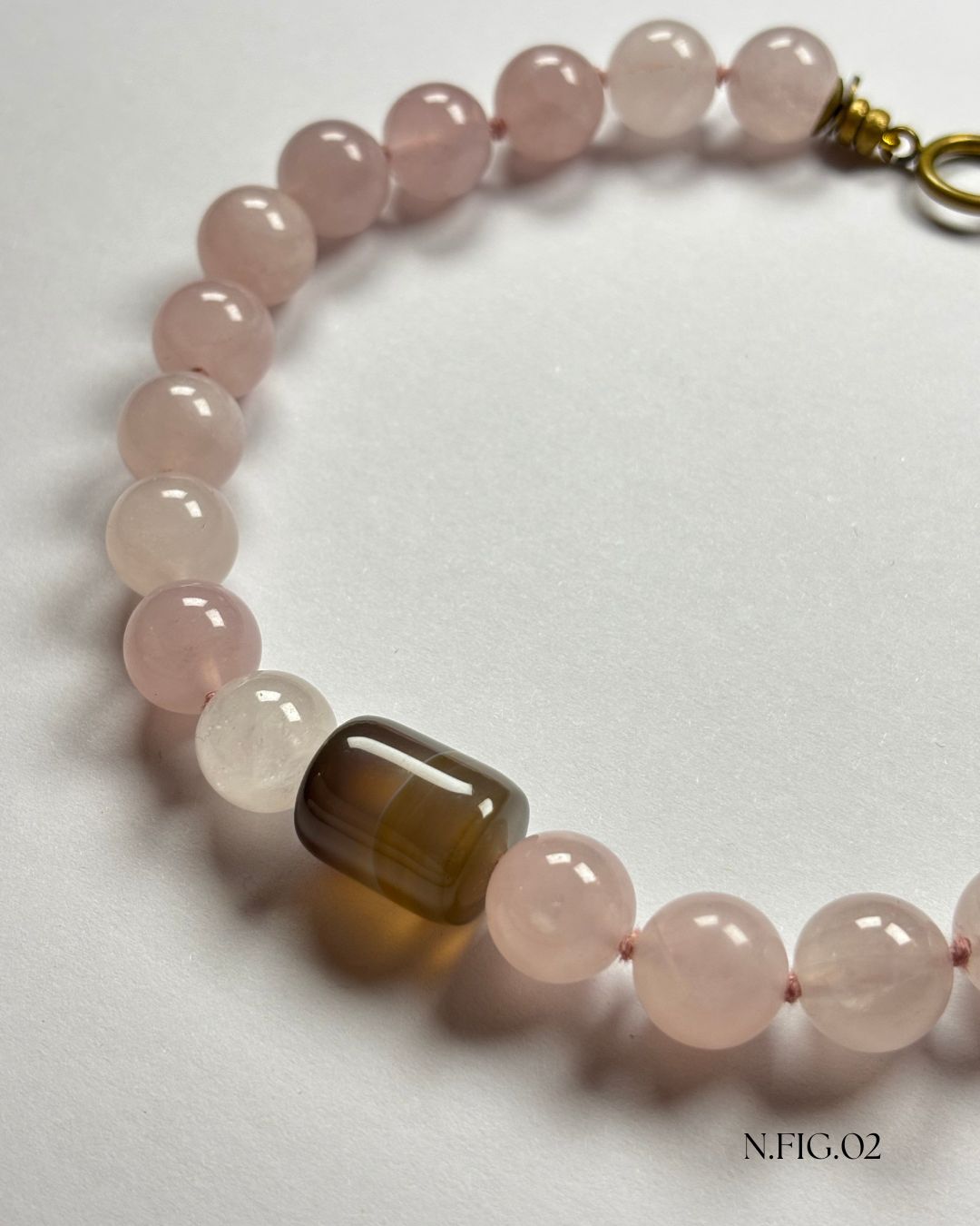 16-inch necklace featuring soft pink rose quartz and grey lace agate beads, elegantly strung on silk. The gentle hues evoke calm and emotional warmth.