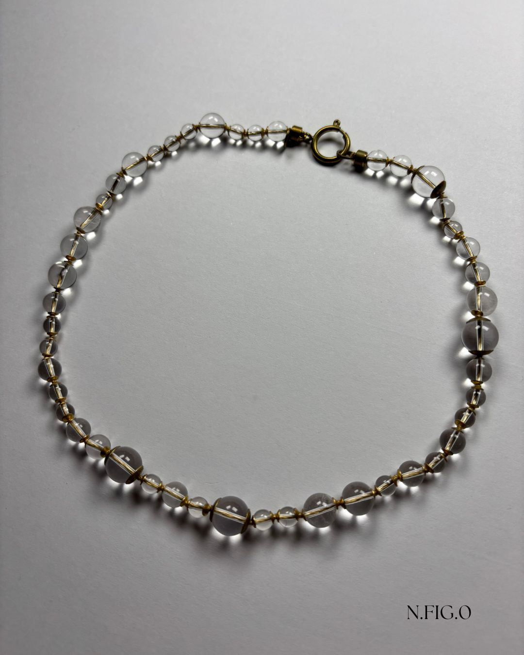 Rock crystal necklace with clear quartz beads, known for clarity and energetic amplification